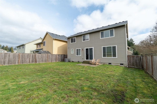 back of house featuring crawl space, cooling unit, a lawn, and a patio area