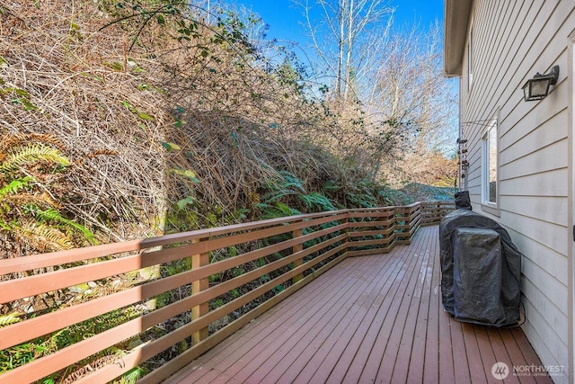 wooden deck featuring area for grilling