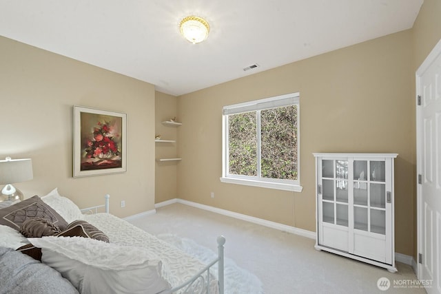 bedroom with visible vents, baseboards, and carpet floors