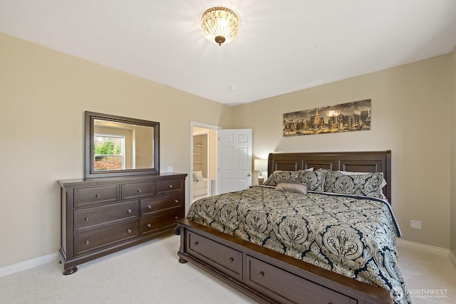 bedroom with baseboards and light colored carpet