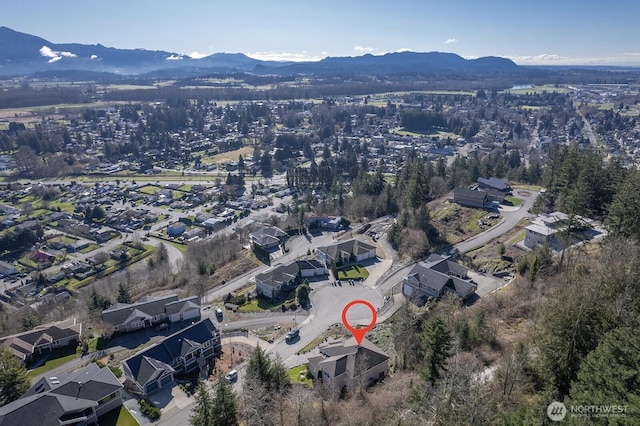 drone / aerial view featuring a mountain view