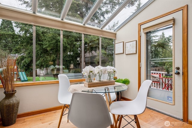 sunroom featuring a healthy amount of sunlight and a skylight