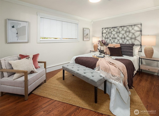 bedroom featuring a baseboard radiator, wood finished floors, and ornamental molding