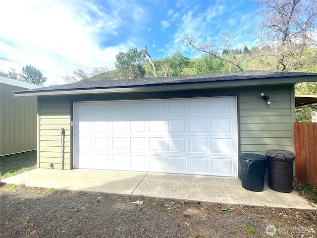 detached garage with fence