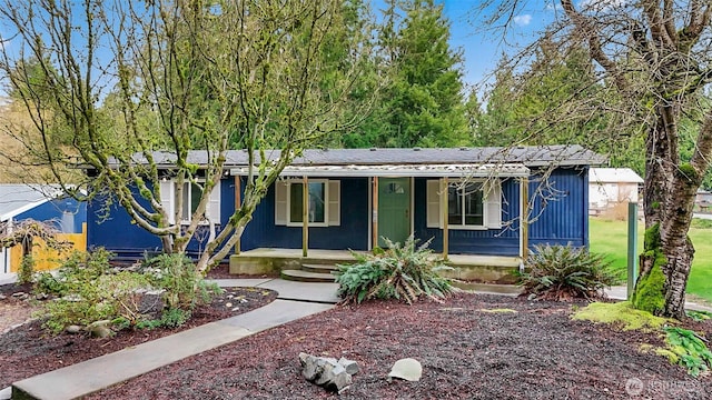 view of front of property featuring covered porch