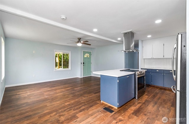 kitchen with visible vents, island exhaust hood, blue cabinetry, appliances with stainless steel finishes, and decorative backsplash