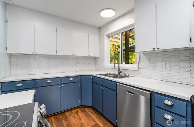 kitchen featuring blue cabinets, dark wood-type flooring, a sink, light countertops, and dishwasher