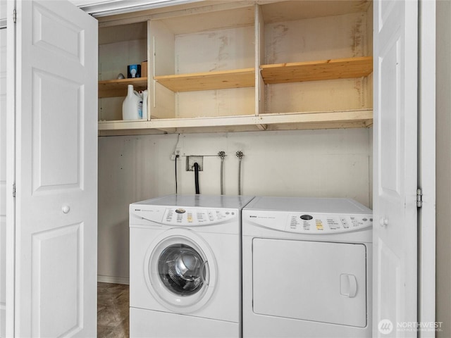 washroom featuring washer and dryer and laundry area