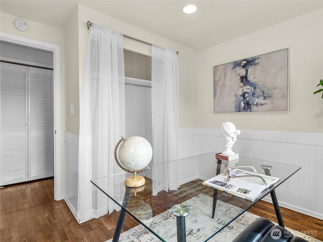 office area featuring recessed lighting, wood finished floors, and a wainscoted wall