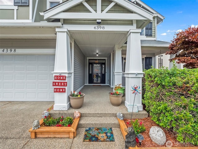 view of exterior entry featuring a garage