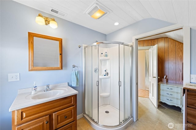 full bathroom with vanity, visible vents, tile patterned flooring, and a stall shower