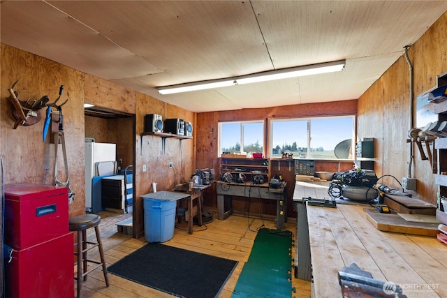 interior space featuring hardwood / wood-style floors and wood walls