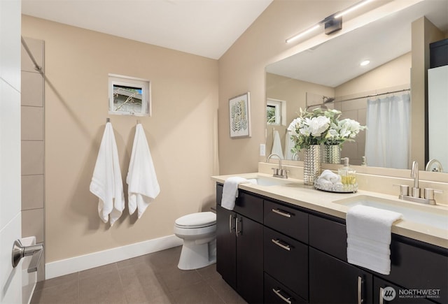 full bath featuring vaulted ceiling, toilet, baseboards, and a sink