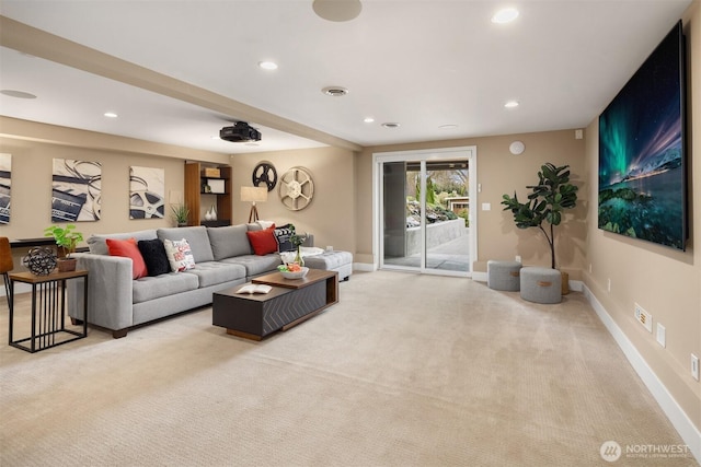 carpeted living area featuring visible vents, recessed lighting, and baseboards