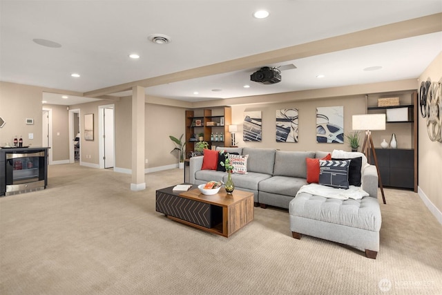 living area with recessed lighting, visible vents, baseboards, and light colored carpet