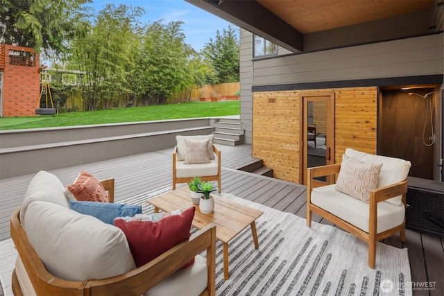 view of patio / terrace with a wooden deck, outdoor lounge area, and fence