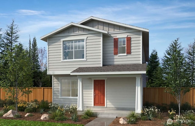 view of front of home with roof with shingles, board and batten siding, and fence