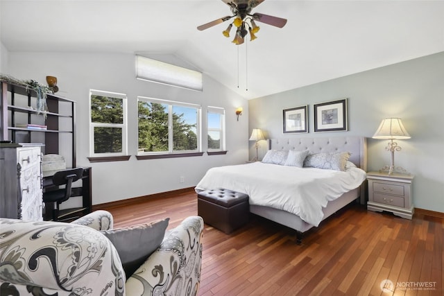 bedroom featuring baseboards, wood-type flooring, ceiling fan, and vaulted ceiling