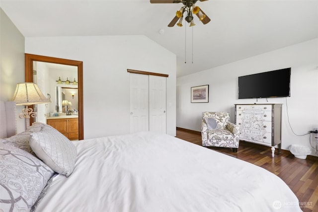 bedroom featuring lofted ceiling, wood finished floors, a closet, and ceiling fan