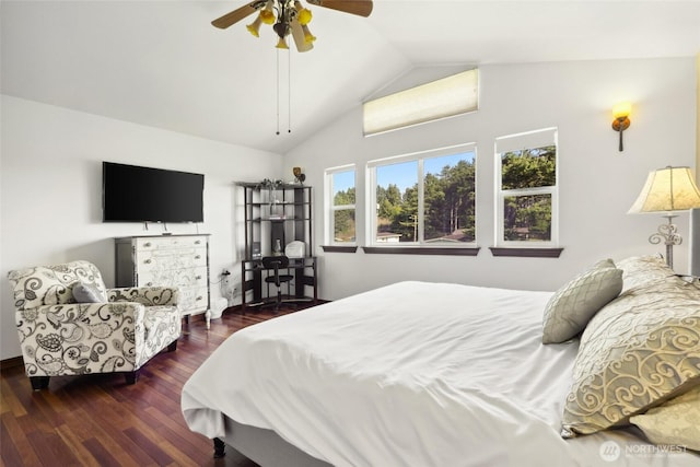 bedroom with ceiling fan, lofted ceiling, and wood finished floors