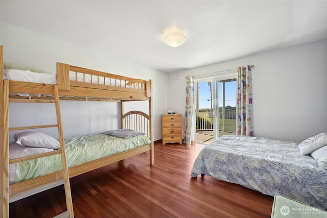 bedroom with access to outside and wood-type flooring