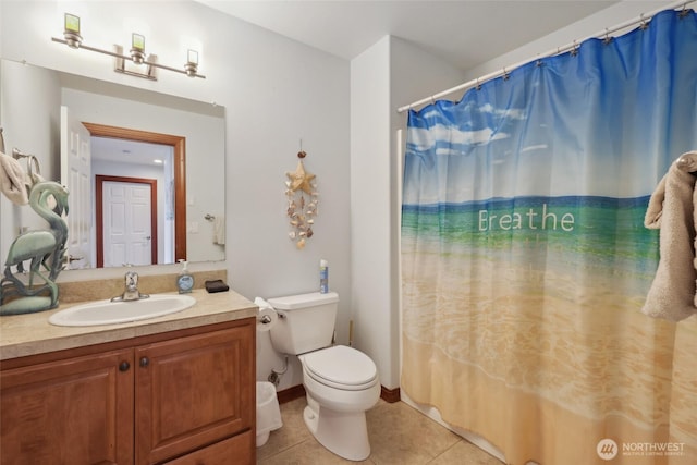 full bath with vanity, baseboards, tile patterned flooring, curtained shower, and toilet