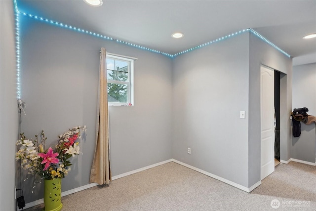 carpeted empty room with recessed lighting and baseboards