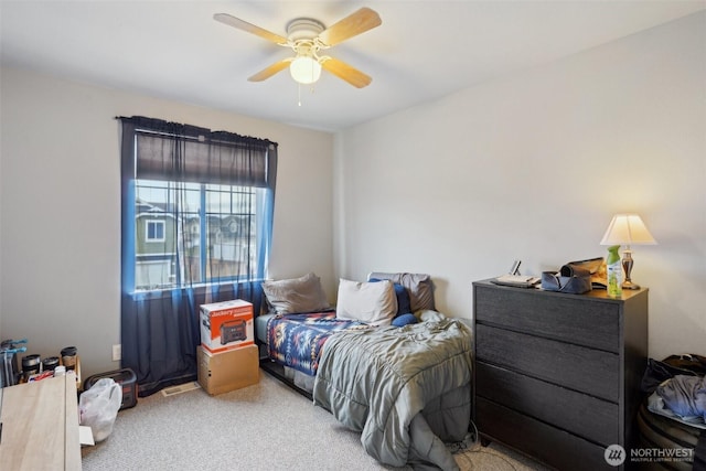 bedroom with ceiling fan and carpet floors