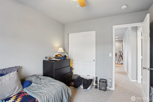 bedroom with carpet flooring, ceiling fan, and baseboards