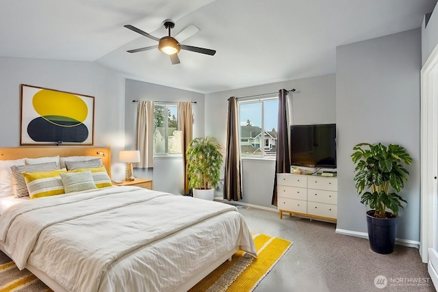 carpeted bedroom with a ceiling fan, baseboards, and vaulted ceiling