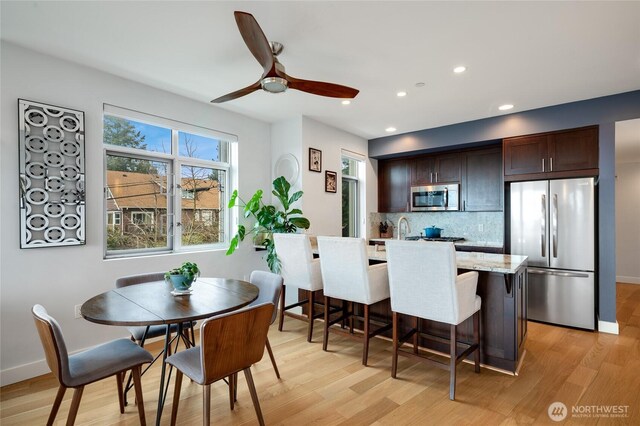 dining area with recessed lighting, baseboards, light wood finished floors, and ceiling fan