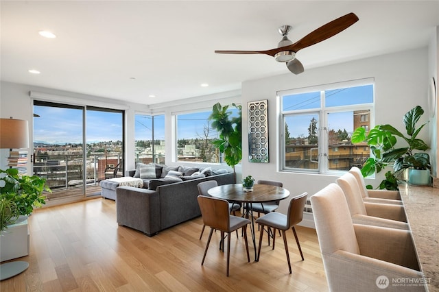 living area featuring recessed lighting, light wood-style flooring, and ceiling fan