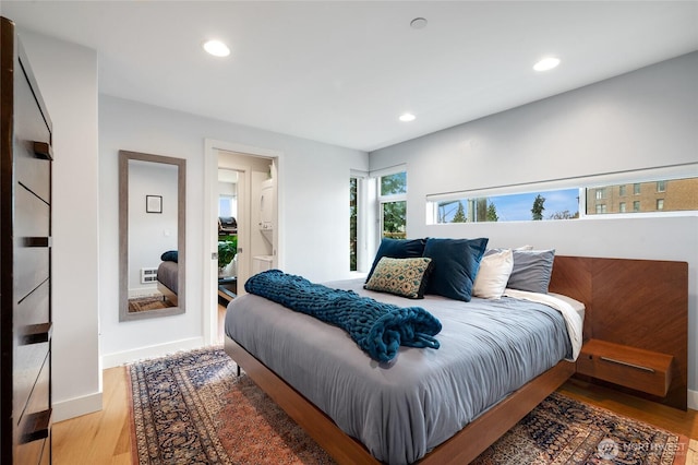 bedroom featuring recessed lighting, light wood-style flooring, and baseboards