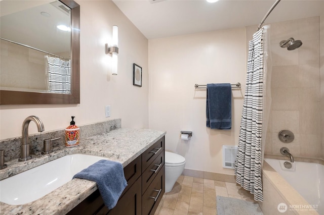 bathroom featuring visible vents, baseboards, toilet, shower / bath combination with curtain, and vanity