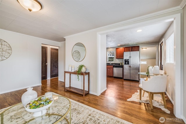 living room with baseboards, dark wood finished floors, and ornamental molding