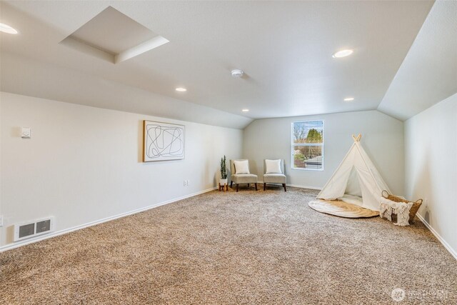 playroom with vaulted ceiling, baseboards, visible vents, and carpet floors