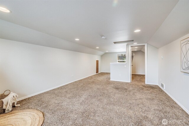 bonus room featuring baseboards, visible vents, carpet floors, recessed lighting, and vaulted ceiling