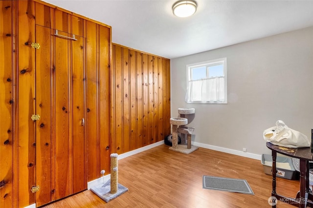 miscellaneous room with visible vents, light wood-style flooring, and baseboards