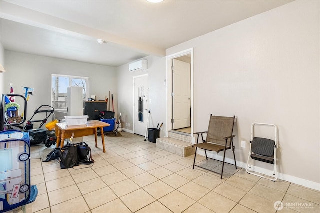 office area featuring light tile patterned flooring, baseboards, and a wall mounted AC