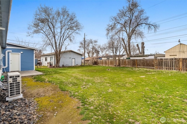 view of yard with ac unit and fence private yard