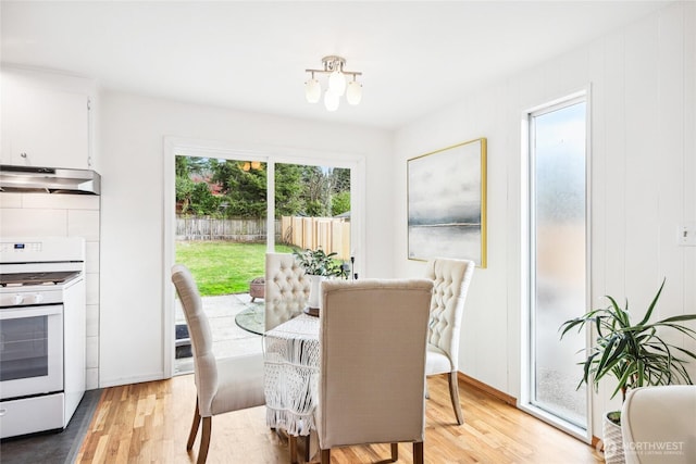 dining area with light wood finished floors