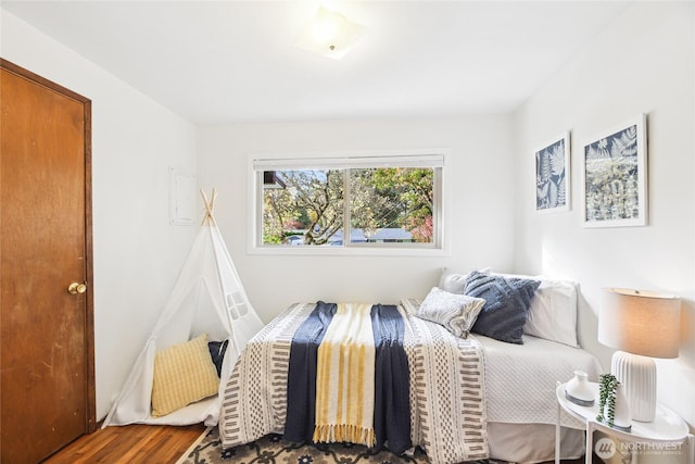 bedroom with wood finished floors