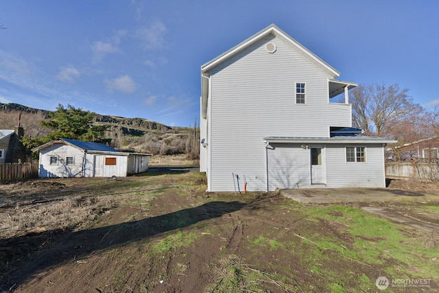 back of house featuring fence and a patio area