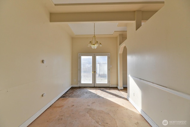 doorway to outside featuring french doors, arched walkways, baseboards, and unfinished concrete floors