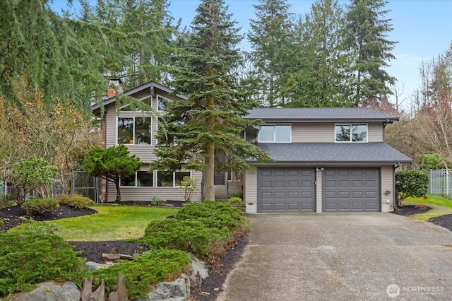 view of front of home with fence, an attached garage, a chimney, concrete driveway, and a front lawn