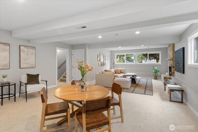 dining room featuring light carpet, recessed lighting, stairway, a fireplace, and baseboards