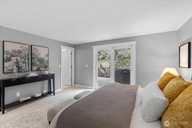 bedroom with access to exterior, baseboards, and carpet floors