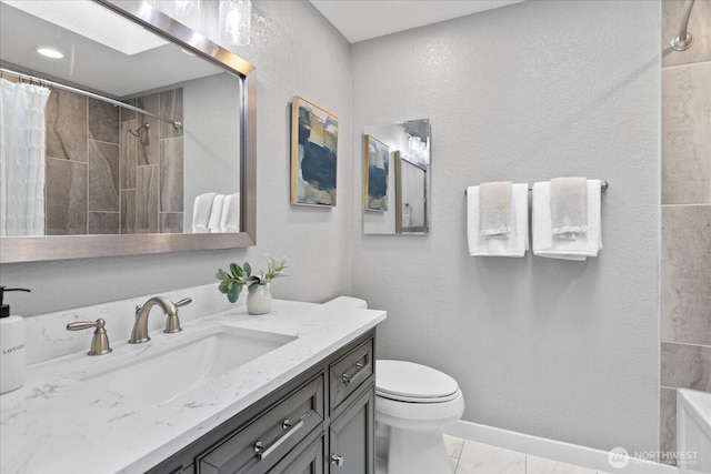 full bath featuring vanity, baseboards, curtained shower, toilet, and a textured wall