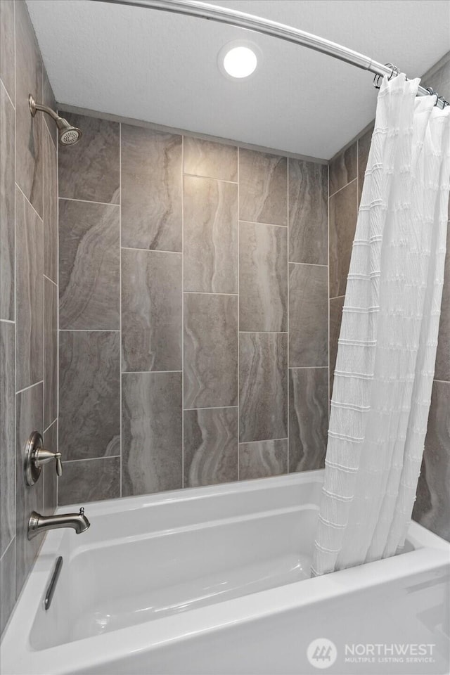 bathroom featuring shower / bath combination with curtain