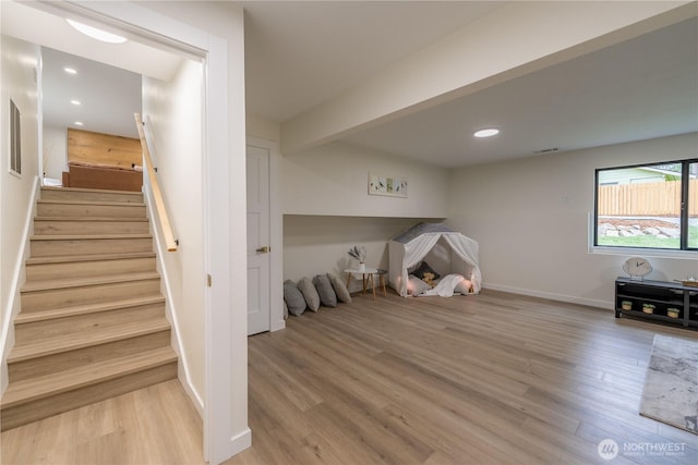 interior space featuring beamed ceiling, visible vents, wood finished floors, recessed lighting, and baseboards